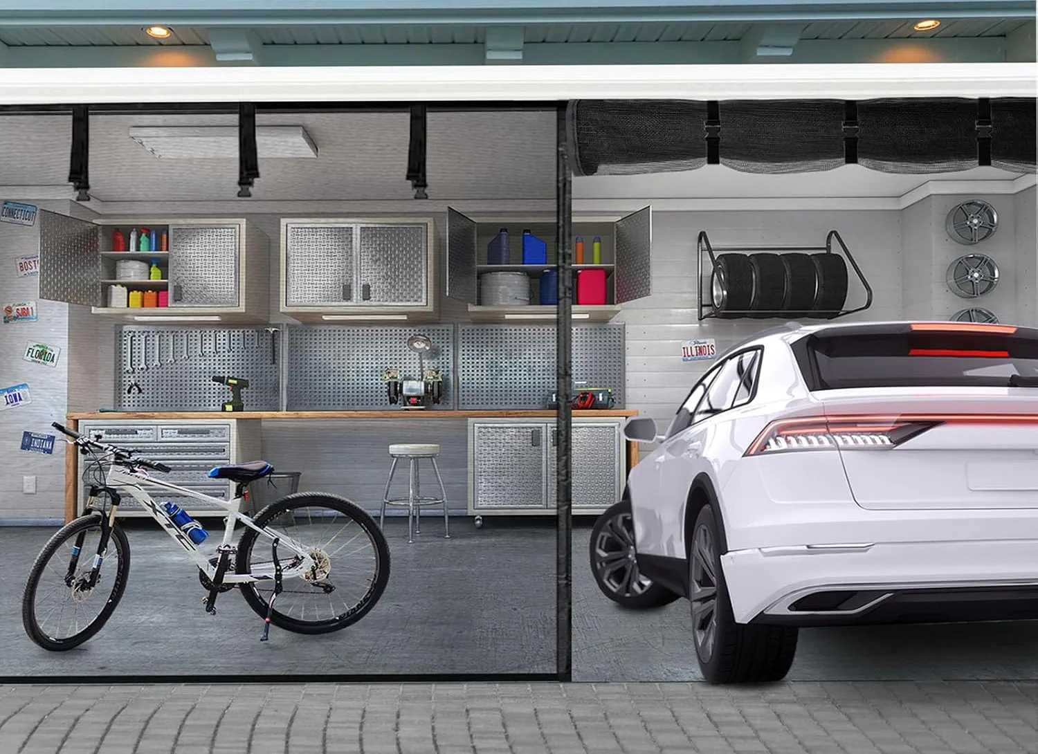 A FEGO garage door screen rolled up and strapped above the opening, with a car parked in the garage