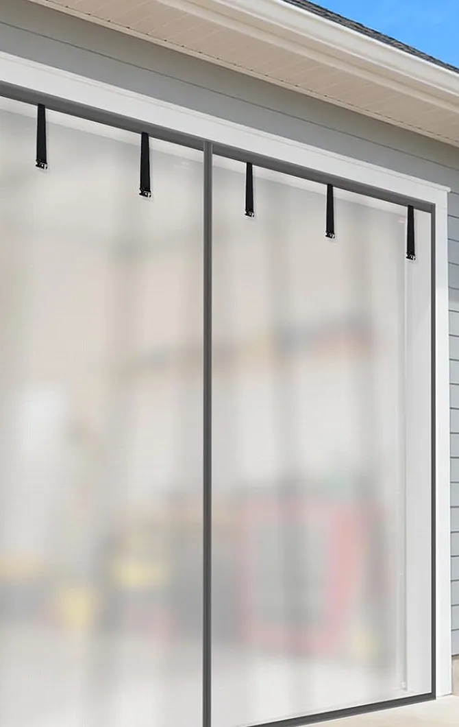 The view in from the street through a FEGO privacy garage door screen: the inside is a blur