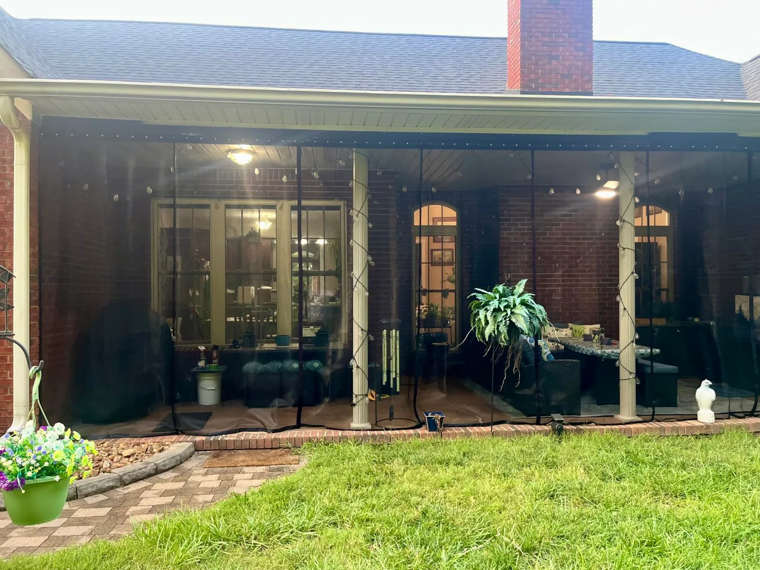 Buyer photo: FEGO sliding screens enclosing the open side of a covered patio