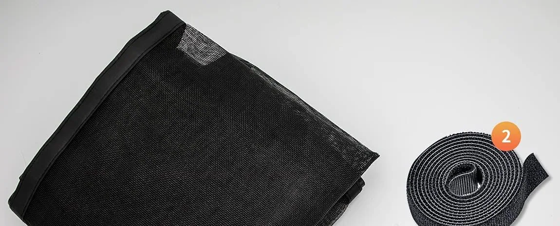 A folded FEGO magnetic screen door with its roll of hook-and-loop strip