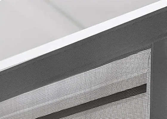 The top edge of a FEGO screen pressed onto the strip along a door frame