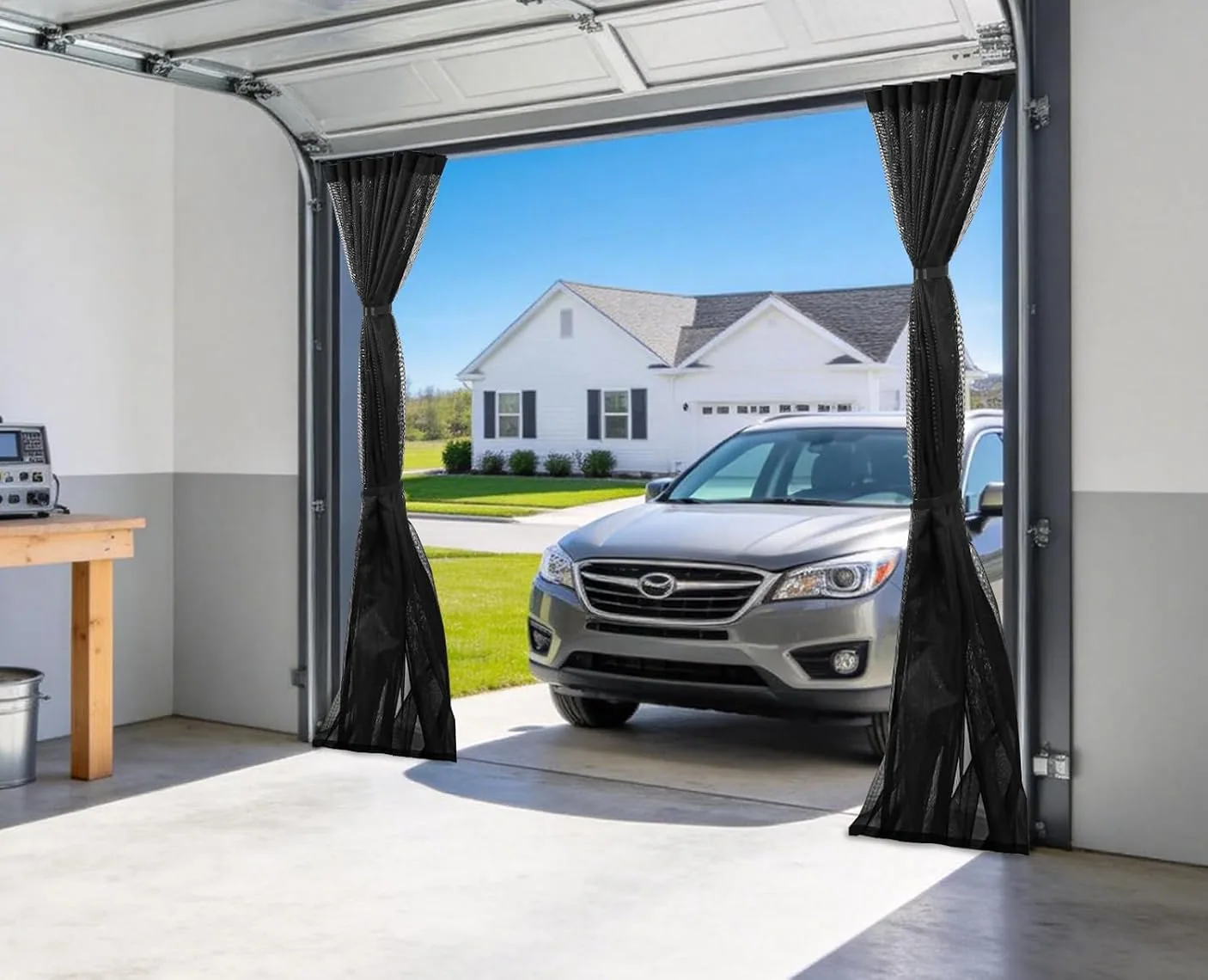 A FEGO sliding garage door screen drawn to both sides, seen from inside the garage